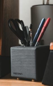 Best pen holders for a home office desk with pens and scissors organized
