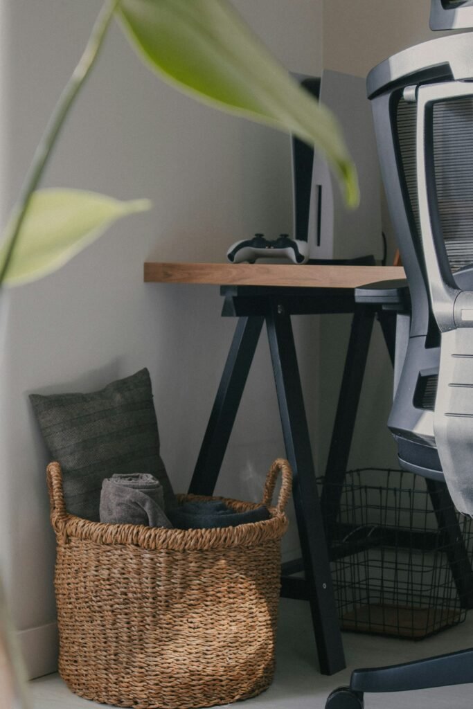 Best storage baskets for a home office desk, woven basket next to a computer