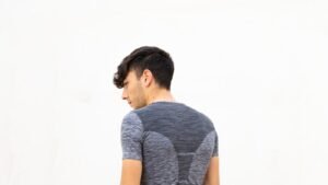 Close-up of a person's upper back and shoulders showing posture
